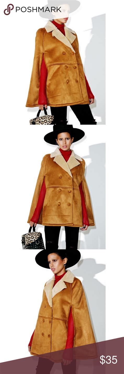 buttoned cape in shearling .